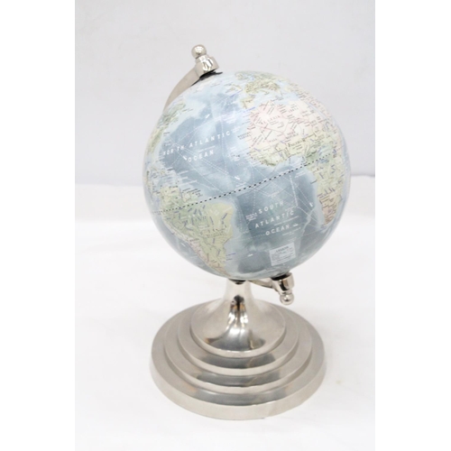 213 - A GLOBE ON A CIRCULAR PEDESTAL BASE, HEIGHT 34CM