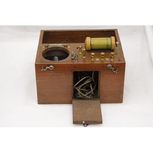 271 - A VINTAGE ELECTRONIC MEDICAL APPLIANCE - IN OAK CASE