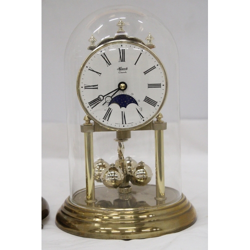 280 - TWO BRASS ANNIVERSARY CLOCKS WITH GLASS DOMES