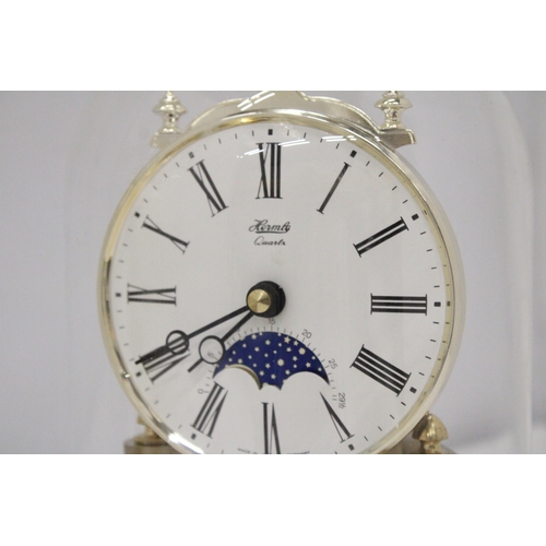 280 - TWO BRASS ANNIVERSARY CLOCKS WITH GLASS DOMES