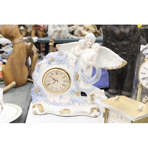 282 - TWO MANTLE CLOCKS TO INCLUDE A CERAMIC ANGEL WITH CHILDREN, PLUS A CARRIAGE CLOCK