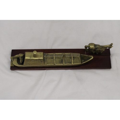 296 - A BRASS BARGE, BARGEE AND TOW HORSE ON A WOODEN BASE, LENGTH 30CM