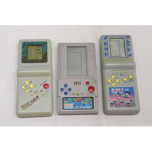 311A - THREE VINTAGE HAND HELD GAMES TO INCLUDE, 'BLOCK GAME', 'SUPER CHALLENGE' AND '5 IN 1'