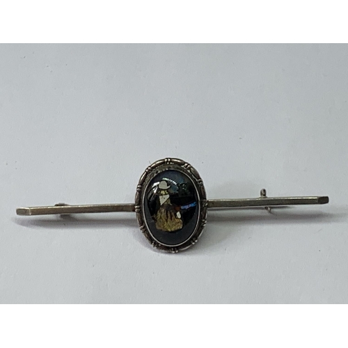 703 - A MARKED SILVER PIN BROOCH WITH LADY DECORATION