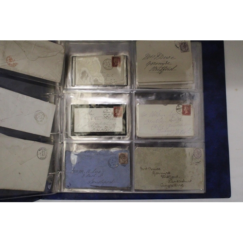 912 - A SELECTION OF VICTORIAN ENVELOPES IN A BLUE BINDER WITH FIFTY PENNY RED STAMPS