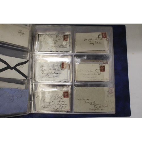 912 - A SELECTION OF VICTORIAN ENVELOPES IN A BLUE BINDER WITH FIFTY PENNY RED STAMPS