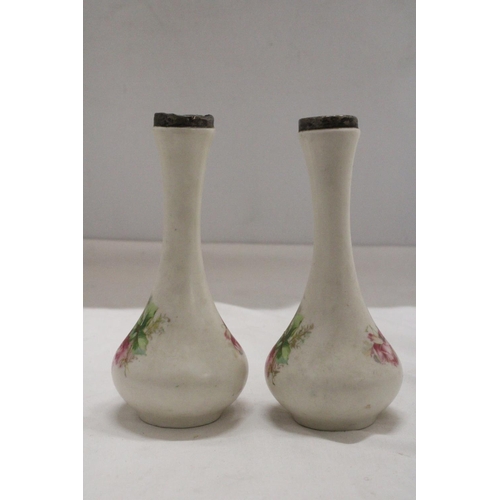 1002 - A PAIR OF VINTAGE FLORAL VSES WITH HALLMARKED SILVER RIMS, HEIGHT 18CM