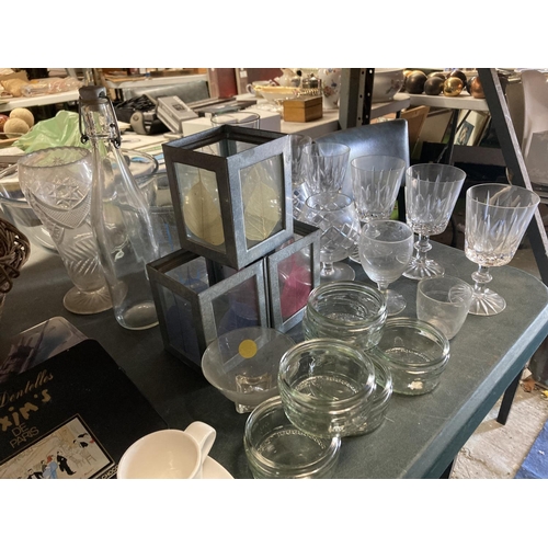 1044 - A LARGE QUANTITY OF GLASSWARE TO INCLUDE TEALIGHT LANTERNS, WINE AND BRANDY GLASSES, TUMBLERS, BOWLS... 