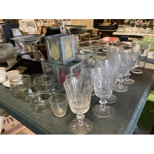 1044 - A LARGE QUANTITY OF GLASSWARE TO INCLUDE TEALIGHT LANTERNS, WINE AND BRANDY GLASSES, TUMBLERS, BOWLS... 