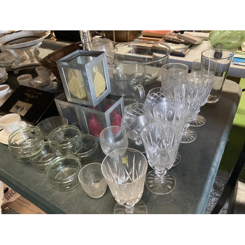 1044 - A LARGE QUANTITY OF GLASSWARE TO INCLUDE TEALIGHT LANTERNS, WINE AND BRANDY GLASSES, TUMBLERS, BOWLS... 