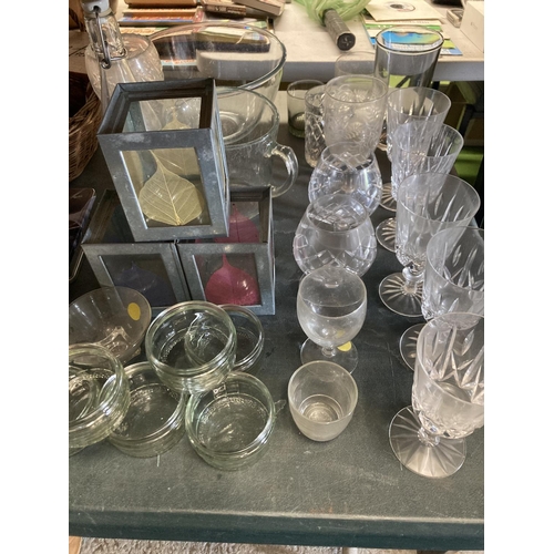 1044 - A LARGE QUANTITY OF GLASSWARE TO INCLUDE TEALIGHT LANTERNS, WINE AND BRANDY GLASSES, TUMBLERS, BOWLS... 