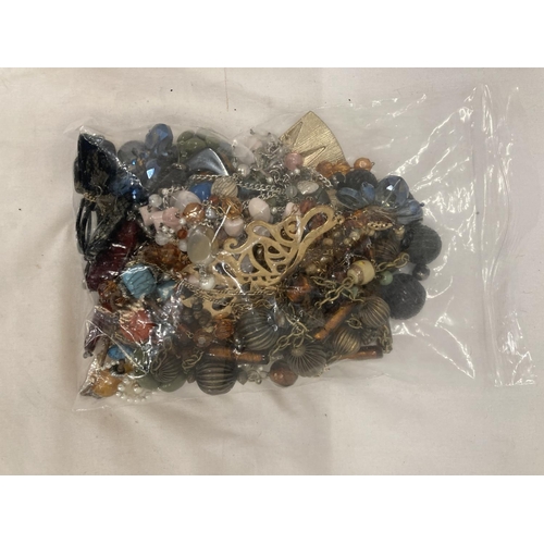 1066 - A BAG OF VINTAGE COSTUME JEWELLERY