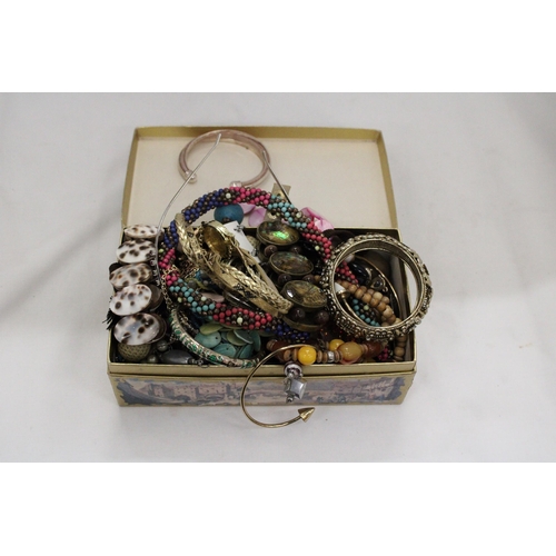 1184 - A QUANTITY OF COSTUME JEWELLERY TO INCLUDE NECKLACES, EARRINGS, BANGLES, ETC, IN A DOMED BOX