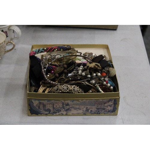 1184 - A QUANTITY OF COSTUME JEWELLERY TO INCLUDE NECKLACES, EARRINGS, BANGLES, ETC, IN A DOMED BOX