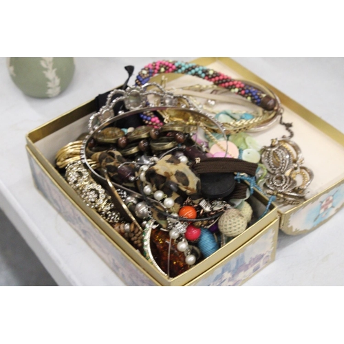 1184 - A QUANTITY OF COSTUME JEWELLERY TO INCLUDE NECKLACES, EARRINGS, BANGLES, ETC, IN A DOMED BOX