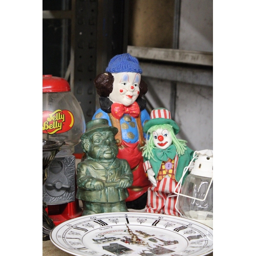 1215 - A VINTAGE JELLY BEAN MACHINE, A MUD MAN FIGURE, A WARRINGTON WALL CLOCK, CLOWNS, ETC