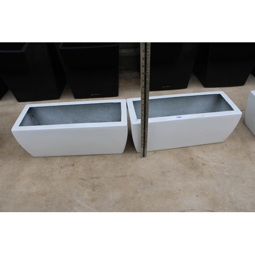 1523 - A PAIR OF WHITE LOW FIBRE GLASS TROUGH PLANTERS (H:20 L:49CM)