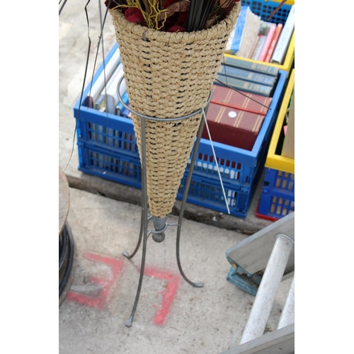 1867 - A METAL PLANT STAND WITH WICKER BASKET AND ARTIFICIAL FLOWERS