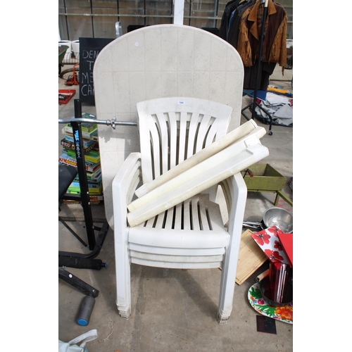 1940 - A WHITE PLASTIC GARDEN TABLE AND FOUR STACKING CHAIRS