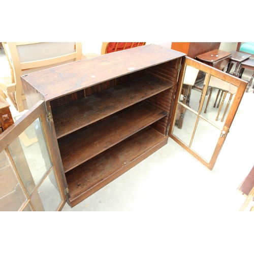 2947 - AN EARLY 20TH CENTURY TWO DOOR GLAZED BOOKCASE WITH BRASS HANDLES, 43