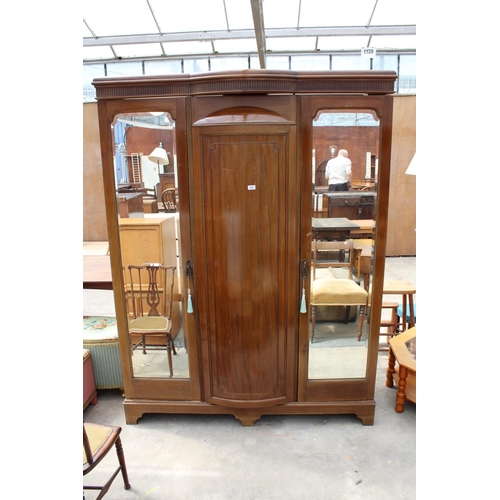 2950 - AN EDWARDIAN MAHOGANY PARTIALLY BOW FRONTED MIRROR-DOOR WARDROBE ON BRACKET FEET, 61