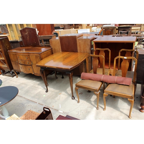 2989 - A MID 20TH CENTURY WALNUT DINING SUITE COMPRISING DRAW LEAF TABLE, FOUR CHAIRS AND SIDEBOARD