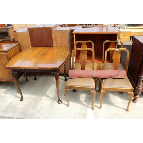 2989 - A MID 20TH CENTURY WALNUT DINING SUITE COMPRISING DRAW LEAF TABLE, FOUR CHAIRS AND SIDEBOARD