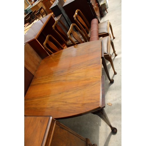 2989 - A MID 20TH CENTURY WALNUT DINING SUITE COMPRISING DRAW LEAF TABLE, FOUR CHAIRS AND SIDEBOARD