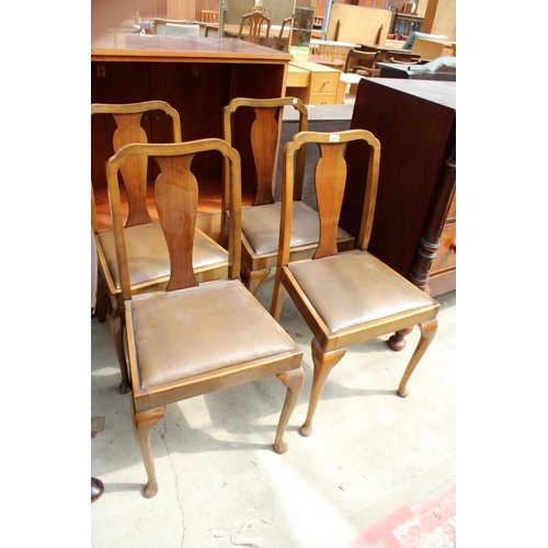 2989 - A MID 20TH CENTURY WALNUT DINING SUITE COMPRISING DRAW LEAF TABLE, FOUR CHAIRS AND SIDEBOARD