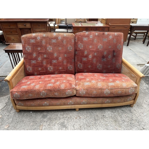 3047 - AN ERCOL ELM BERGERE SETTEE