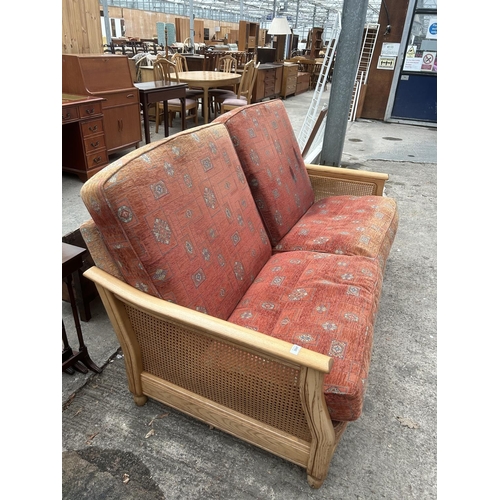 3047 - AN ERCOL ELM BERGERE SETTEE