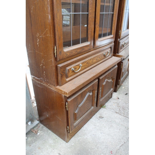 3052 - AN OAK CABINET WITH GLAZED AND LEADED UPPER PORTION, 37