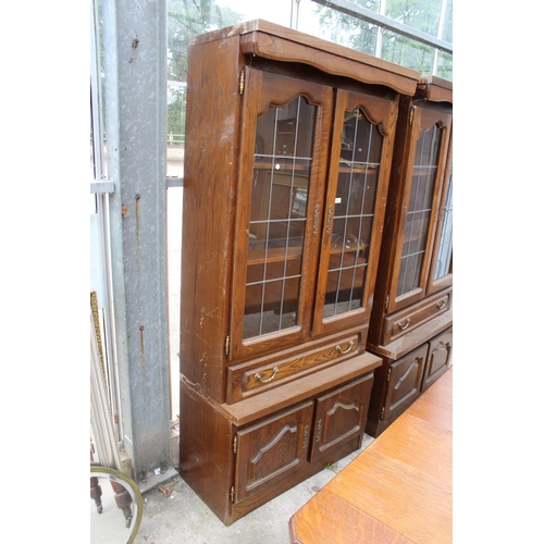 3052 - AN OAK CABINET WITH GLAZED AND LEADED UPPER PORTION, 37