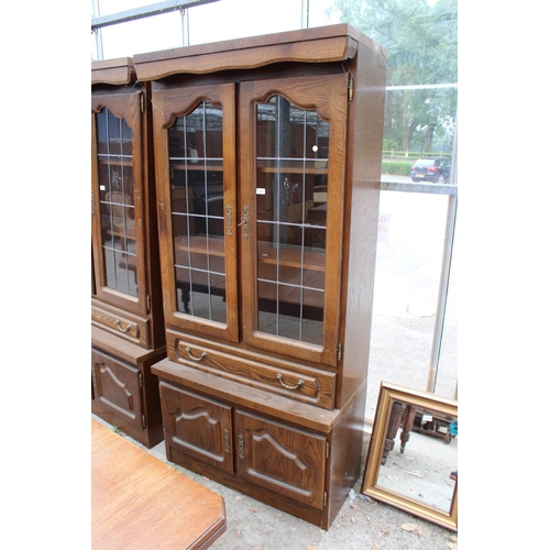 3053 - AN OAK CABINET WITH GLAZED AND LEADED UPPER PORTION, 37