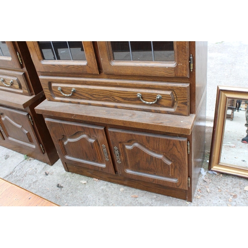 3053 - AN OAK CABINET WITH GLAZED AND LEADED UPPER PORTION, 37