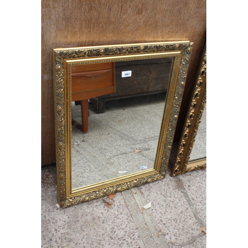 3067 - A MODERN GILT FRAMED WALL MIRROR, 28