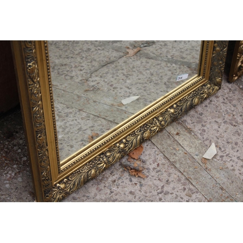 3067 - A MODERN GILT FRAMED WALL MIRROR, 28