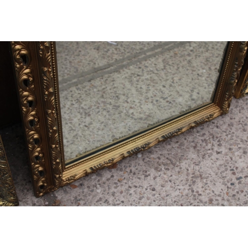 3068 - A MODERN GILT FRAMED WALL MIRROR, 33