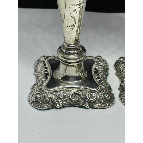 76 - A PAIR OF HALLMARKED BIRMINGHAM SILVER CANDLESTICKS GROSS WEIGHT 212.7 GRAMS (ONE HAS WEIGHTED BASE)