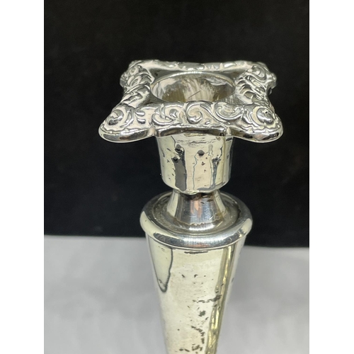 76 - A PAIR OF HALLMARKED BIRMINGHAM SILVER CANDLESTICKS GROSS WEIGHT 212.7 GRAMS (ONE HAS WEIGHTED BASE)