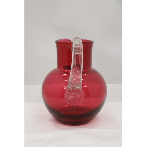 134 - A LARGE CRANBERRY GLASS JUG