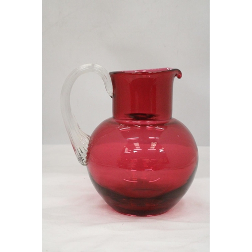 134 - A LARGE CRANBERRY GLASS JUG