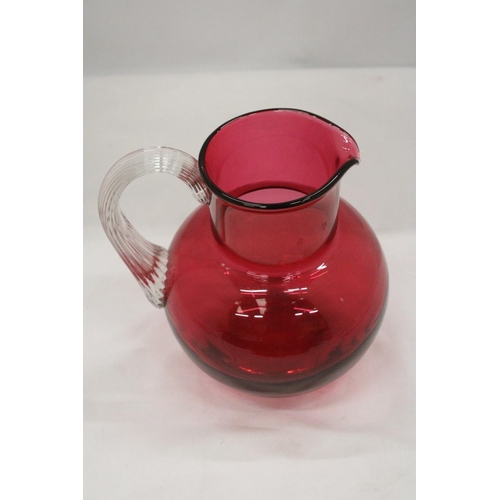 134 - A LARGE CRANBERRY GLASS JUG