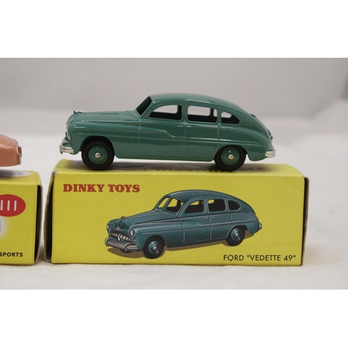 149 - TWO BOXED DINKY CARS, TRIUMPH TR2 SPORTS AND FORD VEDETTE 49