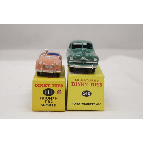 149 - TWO BOXED DINKY CARS, TRIUMPH TR2 SPORTS AND FORD VEDETTE 49