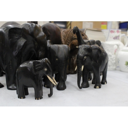 163 - A COLLECTION OF TREEN ELEPHANTS TO INCLUDE BOOK-ENDS