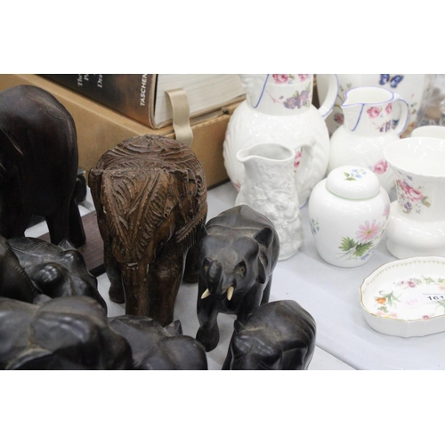 163 - A COLLECTION OF TREEN ELEPHANTS TO INCLUDE BOOK-ENDS