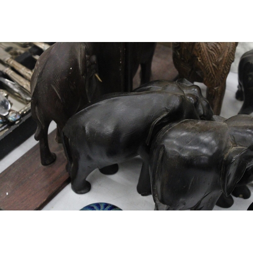 163 - A COLLECTION OF TREEN ELEPHANTS TO INCLUDE BOOK-ENDS