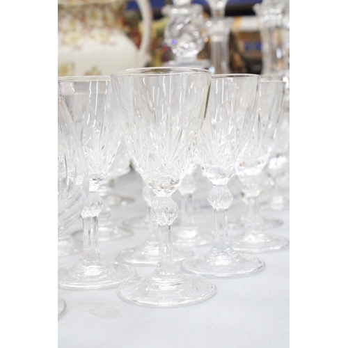 167 - A QUANTITY OF GLASSWARE TO INCLUDEFIVE DECANTERS, WINE GLASSES, SHERRY, BRANDY BALLOONS, ETC