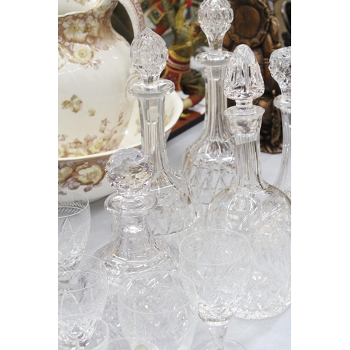 167 - A QUANTITY OF GLASSWARE TO INCLUDEFIVE DECANTERS, WINE GLASSES, SHERRY, BRANDY BALLOONS, ETC